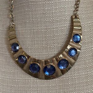 Elegant Gold Necklace with Deep Blue Gems